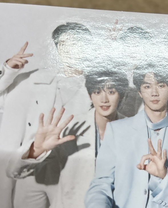 團 SR團卡（丁頭上有廠損壓痕，對光可見）